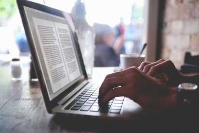 using a laptop in a cafe